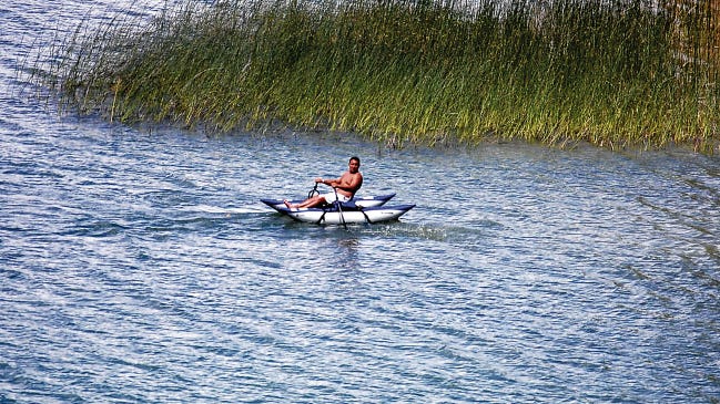 A small catamaran raft sails on July 11 on Farmington Lake.
