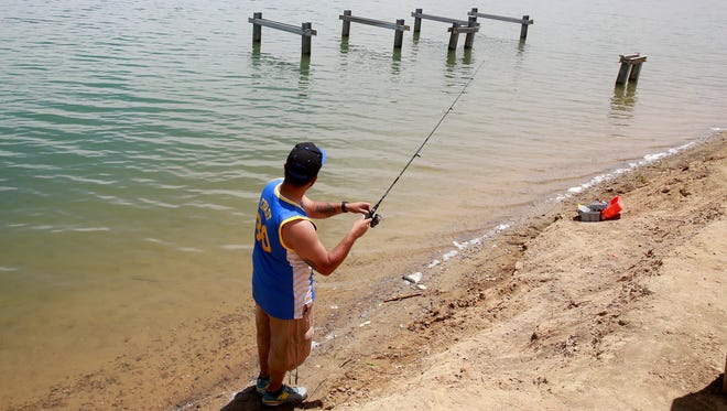 Gabriel Salazar of Bloomfield gets some fishing in on Friday June 3, 2016, at Farmington Lake.