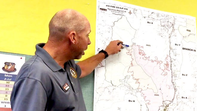 Operations Section Chief Alex Robertson of the Portland National Incident Management Organization shows the area where the 416 Fire made a run through some wildland before slowing again as he conducts an online operational briefing Wednesday morning.