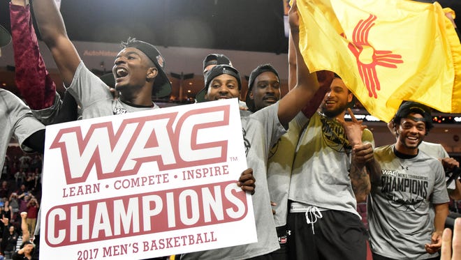 New Mexico State celebrates winning the Western Athletic Conference Tournament championship in 2019 at the Orleans Arena in Las Vegas, Nevada.
