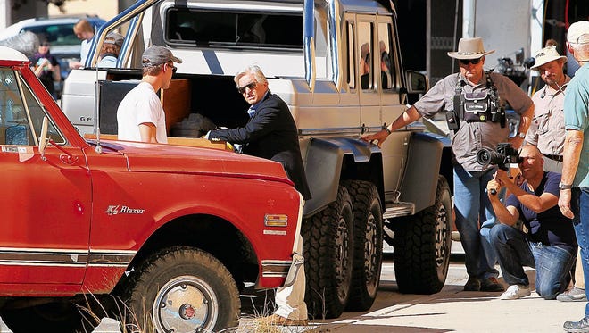 Actor Michael Douglas, center, is seen during the filming of "Beyond The Reach" on Oct. 1, 2013, on North Behrend Avenue in downtown Farmington. The film's director chose to shoot the project in San Juan County largely because of its landscapes, according to a state film office official.