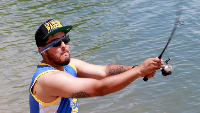 Angler Gabriel Salazar, of Bloomfield, casts his line Friday at Farmington Lake.