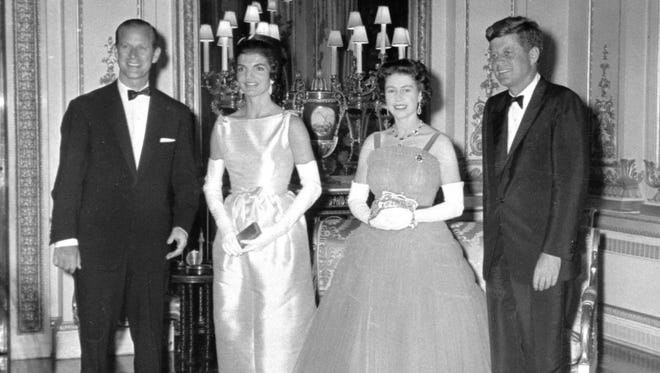 Queen Elizabeth II and her husband, Prince Philip, pose with President John F. Kennedy and first lady Jacqueline Kennedy before a state banquet at Buckingham Palace on June 5, 1961.