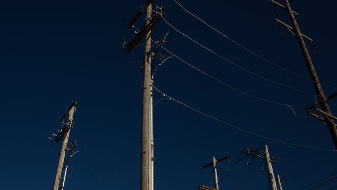 Utility lines run near an electric substation in Aztec, New Mexico, part of the region's electrical grid.