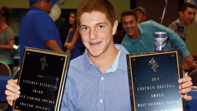 Cavemen sophomore pitcher Trevor Rogers flashes his team and district accolades at Monday's end-of-the-year banquet at the Leo Sweet Center.