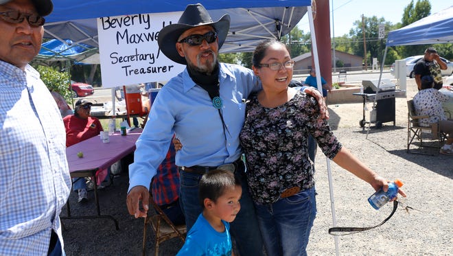 Shiprock Chapter President candidate William Lee poses for photos with voters, Tuesday, Aug. 30, 2016 at the Shiprock Chapter House.