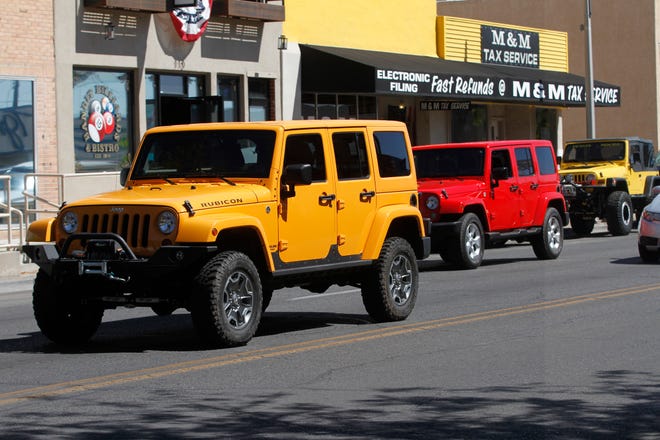 Jeeps drive down West Main Main Street for a  Four Corners 4x4 Week, Friday, Sept. 7, 2018 in Farmington.