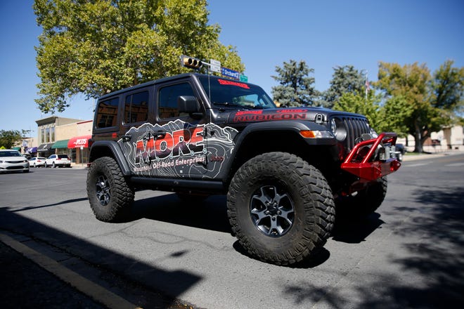 A Jeep Rubicon drives past the Three Rivers Brewery, Friday, Sept. 7, 2018 during a lunch event for the Four Corners 4x4 Week in Farmington.