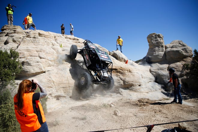Jason Feuilly of Cortez, Colorado, climbs his unlimited up a rock feature, Saturday, Sept. 8, 2018 during the W.E. Rock Grand Nationals at the Brown Spring Campground rock crawl in Glade Run north of Farmington.