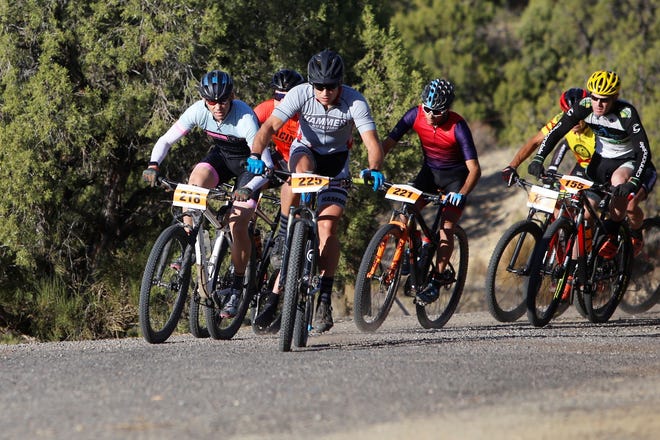 Durango's Brent Winebarger (bib 225) stays ahead of Durango's Travis Brown (218), Durango's Rotem Ishay (221) and Durango's DJ Claassen (155) on the first big turn of the long-course race at the 38th annual Road Apple Rally Saturday at Lions Wilderness Park in Farmington. Winebarger beat Brown by 0.53 seconds for the title.
