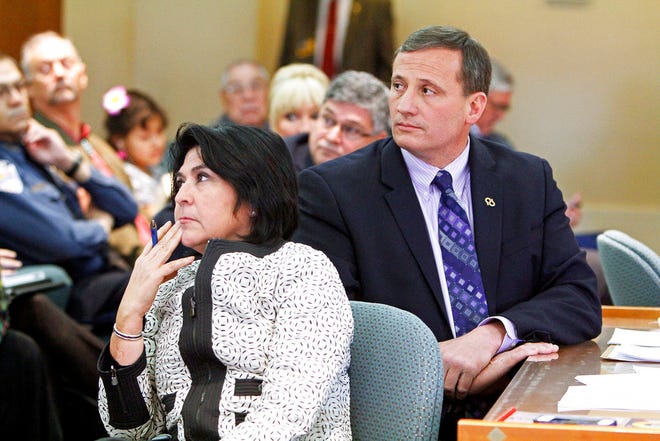In this Feb. 8, 2014 file photo, Demesia Padilla, the former Cabinet Secretary with State Revenue and Taxation Department, left, and former Rep. Paul Pacheco, R-Albuquerque, listen to the audiences during a committee meeting at the New Mexico State Capitol in Santa Fe. A state District Court judge for Sandoval County last week sentenced Padilla on her June jury convictions for embezzlement and computer access with intent to defraud or embezzle.