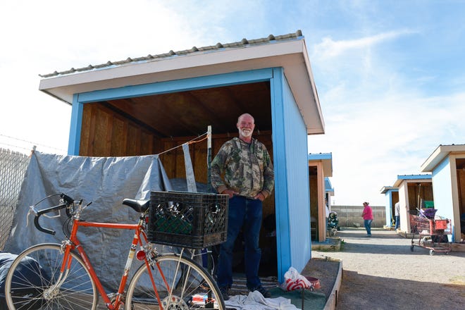 Alan Abrams stands in front of his tent Thursday, Nov. 29, 2018, at Camp Hope, a government-sanctioned tent city for the homeless at Las Cruces' Community of Hope.