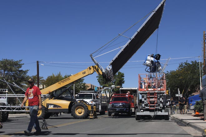 Film crew members work on the set of the movie, The Reach" along South Auburn Avenue in Farmington on Oct. 1, 2013.