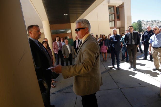 Aztec Municipal School District Superintendent Kirk Carpenter leads a tour, Tuesday, June 19, 2018 of Aztec High School for members of the Legislative Education Study Committee. A hearing officer recommended notices to revoke his licenses as an educator be dismissed.