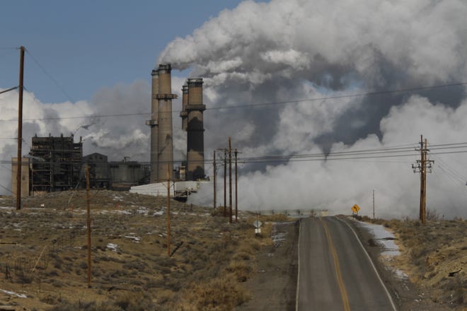 Steam billows from the San Juan Generating Station in January 2013 in Waterflow.