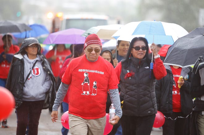 Navajo Nation Vice President Myron Lizer, left, and second lady Dottie Lizer, right, participate in a walk that focused on the issue of missing and murdered Indigenous women and girls on May 23, 2019 in Shiprock.