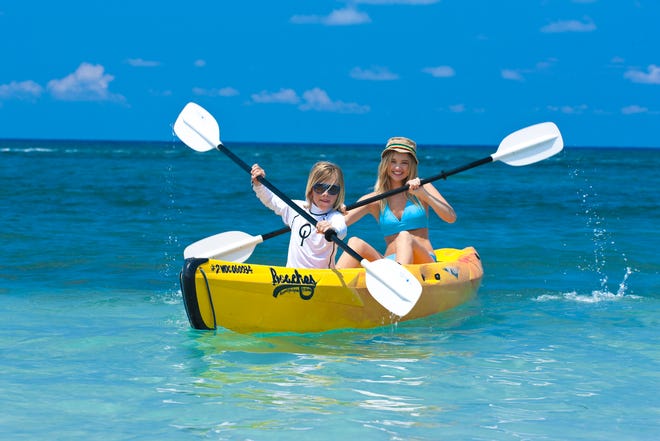 Kayaking right off the beach is a free activity offered at most all-inclusive family resorts.