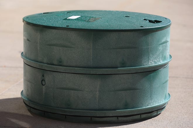 A plastic Polylok Septic Tank Riser with lid.