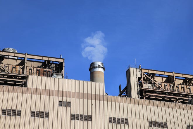Steam rises from one of the units at the San Juan Generating Station.