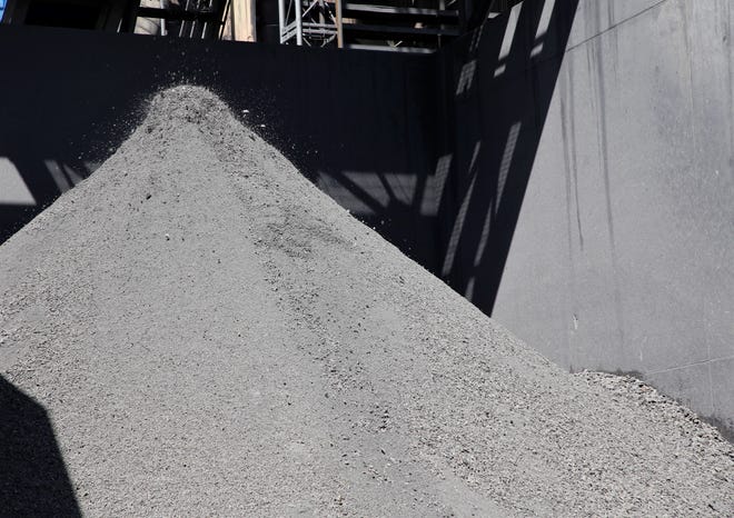 Bottom ash from burning coal is piled, Wednesday, Sept. 25, 2019, at the San Juan Generating Station in Waterflow.