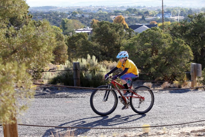 A young rider participates in the 15-mile short course, Saturday, Oct. 5, 2019, during Road Apple Rally in Farmington.