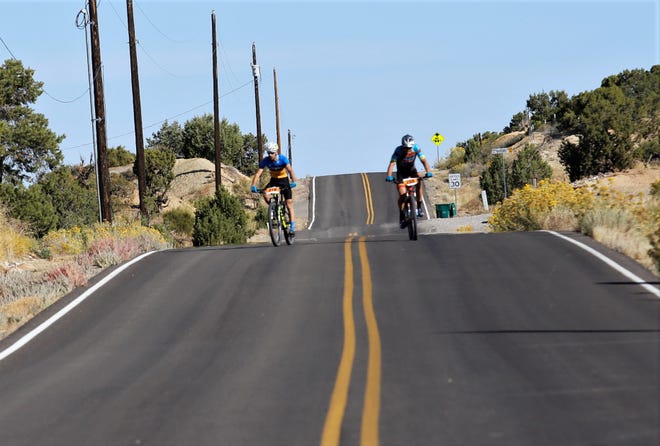 Guy Leshem, left, rides down Foothills Drive, Saturday, Oct. 5, 2019, during the Road Apple Rally to finish third in this year's race.