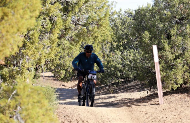 Thomas Deschiney rides through a pinon and juniper forest, Saturday, Oct. 5, 2019, during Road Apple Rally.