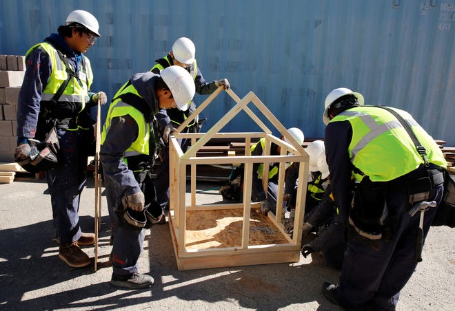 Students from Many Farms High School in Many Farms, Arizona built a 3 feet by 3 feet dog house during the construction technology competition at Skills Fest on Oct. 22 at Navajo Technical University in Crownpoint.