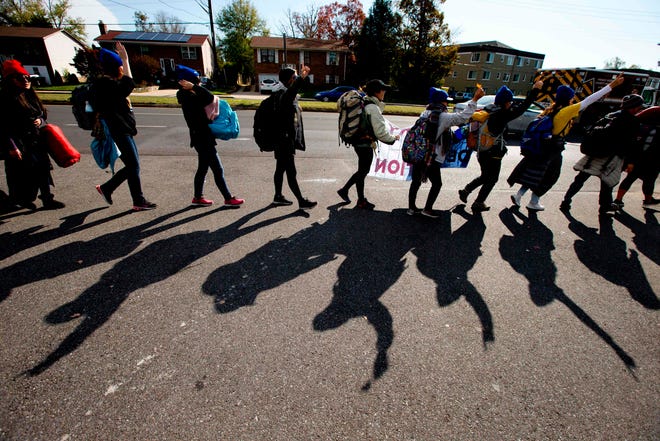 People take part in the Home is Here march for DACA and TPS on Nov.10, 2019, in Langley Park, Md. The group began the march in New York City and will end up at the U.S. Supreme Court.