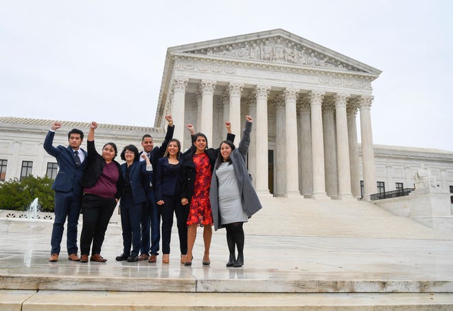 Carolina Fung Feng, third from left, Martin Batalla Vidal, fourth from left, and Eliana Fernandez, third from right join other DACA recipients heading into hear arguments before the U.S. Supreme Court on whether the 2017 Trump administration decision to end the Deferred Action for Childhood Arrivals program (DACA) is lawful on Nov. 12, 2019.