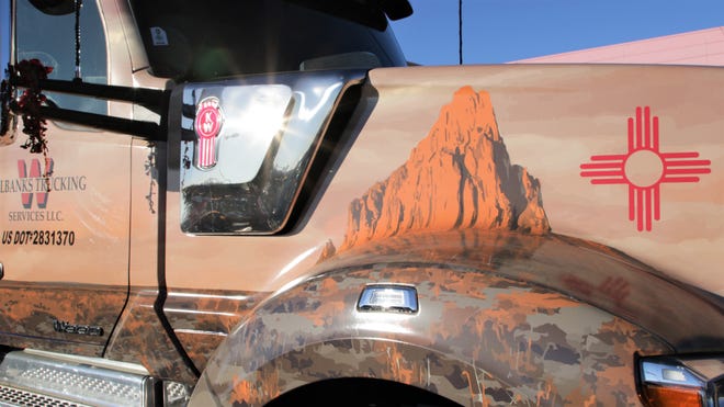 A hand painted decal of the Shiprock pinnacle is seen on the truck carrying the U.S. Capitol Christmas tree at the parking lot of Shiprock High School in Shiprock on Nov. 13, 2019.