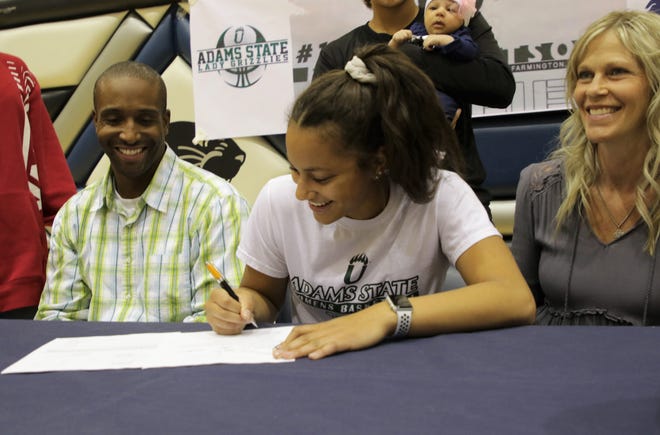 Piedra Vista's Elaina Watson signs her National Letter of Intent on Wednesday to continue her basketball career at NCAA Division II Adams State University.