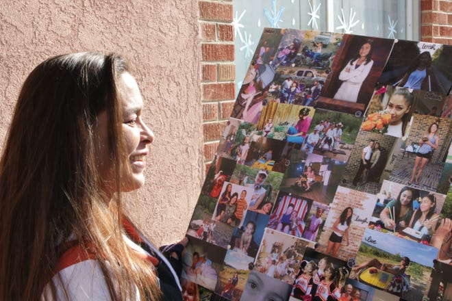 Jamie Lattin looks at a collage of pictures of her daughter, Aztec High School shooting victim Casey Jordan Marquez, in Farmington on Tuesday Dec. 3, 2019.