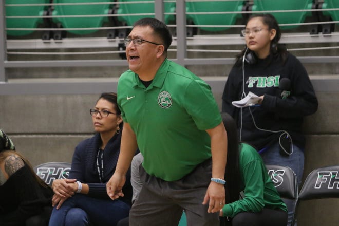 Farmington coach Larenson Henderson yells out to his players playing defense against La Cueva during Tuesday's District 2-5A girls basketball game at Scorpion Arena in Farmington.