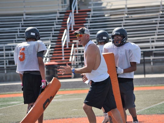 Aztec head football coach Matthew Steinfeldt, seen here during a team practice on Thursday, Aug. 10, 2017, stepped down after eight seasons to take the same position at Bear Creek High School in Lakewood, Colorado.