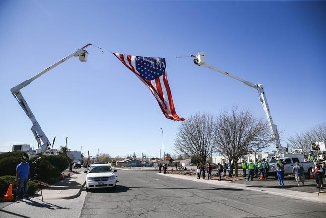 A motorcade procession carrying the body of SFC Antonio Rey "Rod" Rodriguez makes its way through Las Cruces to Getz Funeral Home where hundreds of people pay their respects on Tuesday, Feb. 18, 2020.