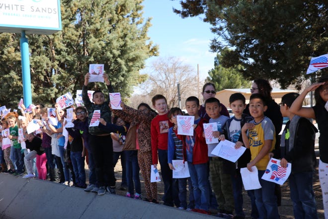 Students at Fairacres Elementary School paid tribute to fallen Las Cruces soldier, Sergeant First Class Antonio Rey Rodriguez, as his motorcade drove by the school down Picahco Avenue on Tuesday, Feb. 18, 2020. Rodriguez is a former student at the elementary school.