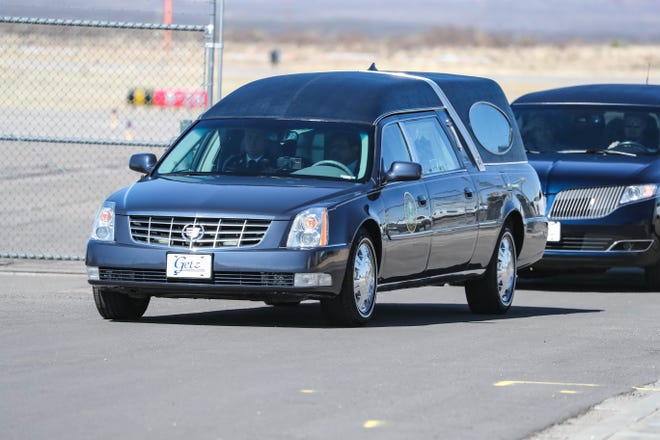 A motorcade procession carrying the body of SFC Antonio Rey "Rod" Rodriguez makes its way through Las Cruces to Getz Funeral Home on Tuesday, Feb. 18, 2020.