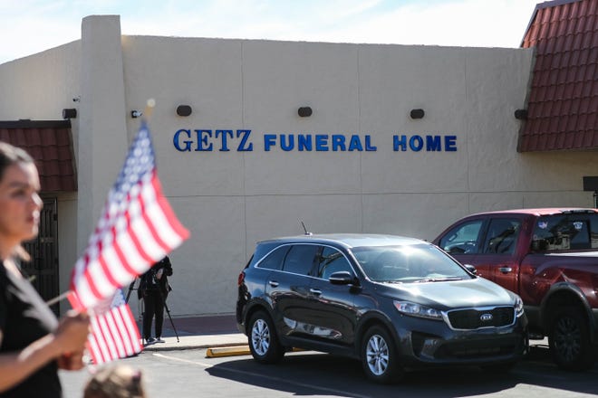 A motorcade procession carrying the body of SFC Antonio Rey "Rod" Rodriguez makes its way through Las Cruces to Getz Funeral Home where hundreds of people pay their respects on Tuesday, Feb. 18, 2020.