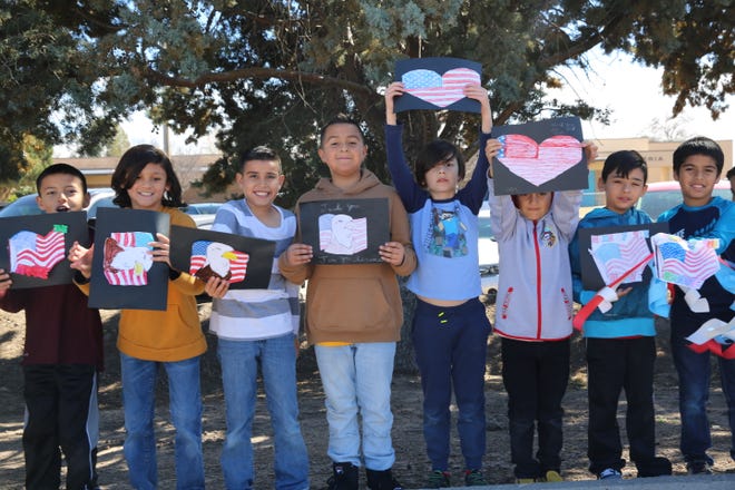 Students at Fairacres Elementary School paid tribute to fallen Las Cruces soldier, Sergeant First Class Antonio Rey Rodriguez, as his motorcade drove by the school down Picahco Avenue on Tuesday, Feb. 18, 2020. Rodriguez is a former student at the elementary school.
