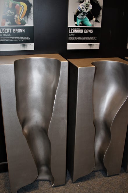 A display that allows visitors the chance to experience the leg and foot sizes of NFL players is included in the "Gridiron Glory" exhibition.