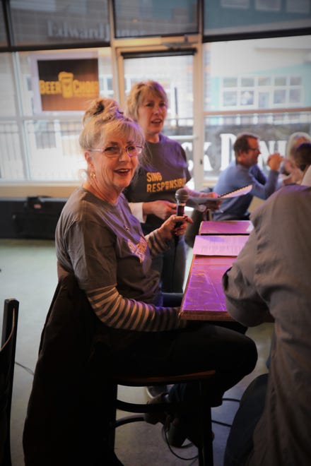 Terri Cross, left, and Virginia Nickels-Hircock are all smiles during the March 11 Beer Choir gathering at Traegers bar in Farmington.