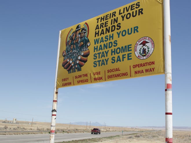 The Navajo Housing Authority placed a sign along U.S. Highway 491 to remind the public to follow health guidelines for combating the coronavirus.