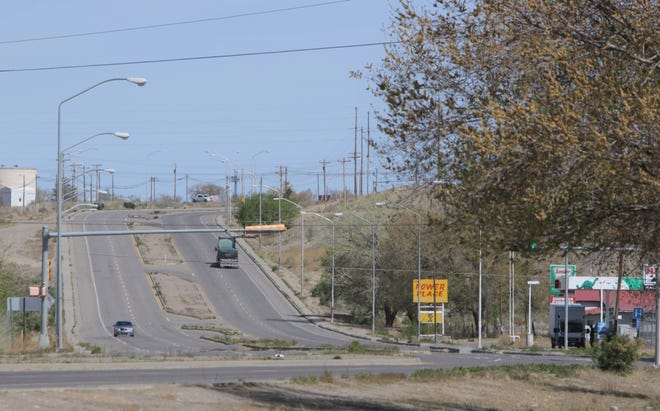 Vehicles move on U.S. Highway 491 in the north side of Shiprock on April 25. Only essential travel is allowed during weekend curfews on the Navajo Nation.