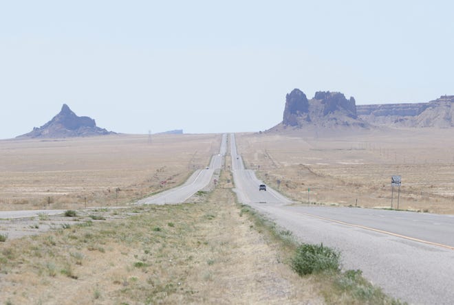 Vehicles move on U.S. Highway 491 between Shiprock and Table Mesa on April 25. Travel has been reduced to essential due to the Navajo Nation being under a weekend curfew to combat the spread of the coronavirus.