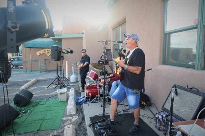 Jose Villareal leads his band through a performance during the opening night of the Sunset Curbside Concert Series on May 13, 2020, at Clancy's Irish Cantina.