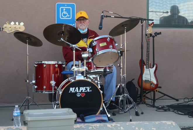 Drummer Robert Beck performs with the Jose Villareal Combo during the Sunset Curbside Concert Series on May 13, 2020, at Clancy's Irish Cantina in Farmington.