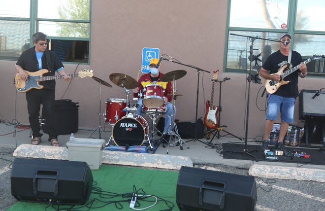 The Jose Villareal Combo performs in the parking lot during the opening night of the Sunset Curbside Concert Series on May 13, 2020, at Clancy's Irish Cantina in Farmington.