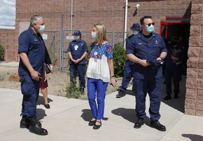 At center, Kimberly Mohs, director for the Health Education Center for Wellness at Northern Navajo Medical Center, talks with Indian Health Service Director Michael Weahkee on May 27 in Shiprock.