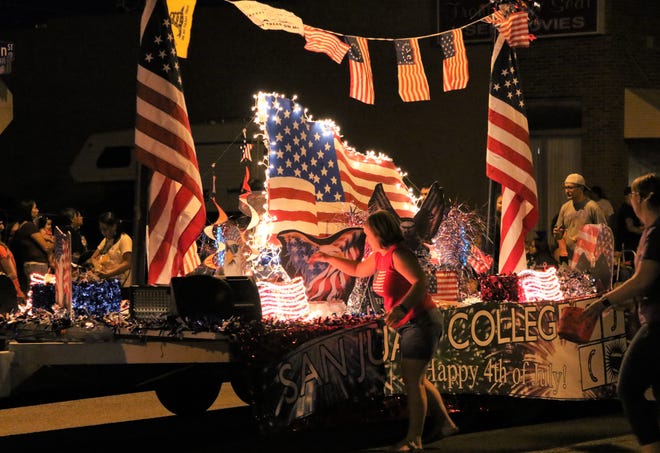 A San Juan College float is towed down West Main Street during the Electric Light Parade on July 4, 2019, in downtown Farmington. This year's parade will be held on the college campus with a drive-thru format.